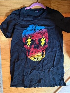 mineB Black Tee with Colorful Floral Skull Graphic
Little cuts part of design